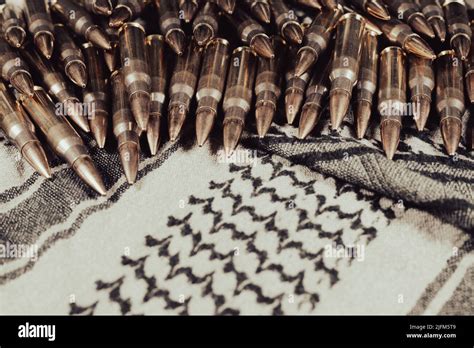 308 Caliber Ammunition On A Green Gray Fabric Background Keffiyeh