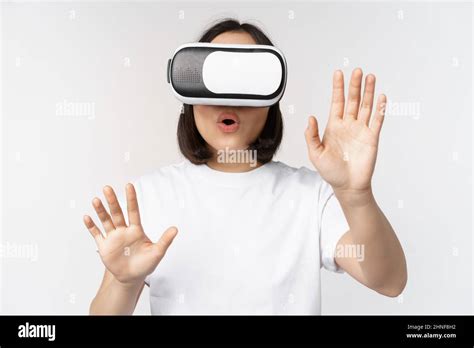 Amused Asian Girl Using Vr Glasses Virtual Reality Headset And