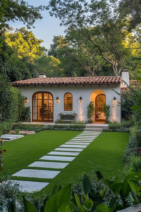 Charming Mediterranean House With Lush Green Garden And Arched Windows Charming Mediterranean House With Lush Green Garden And Arched Windows