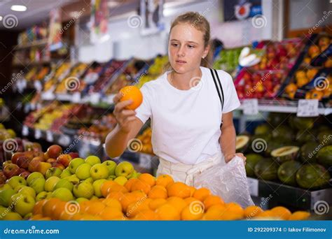 Focused Fifteen Year Old Girl Chooses Ripe Oranges Stock Image Image Focused Fifteen Year Old Girl Chooses Ripe Oranges Stock Image Image