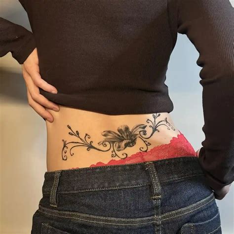 Lower Back Tattoo Designs For Women And Men With Meaning Flowers And Lower Back Tattoo Designs For Women And Men With Meaning Flowers And