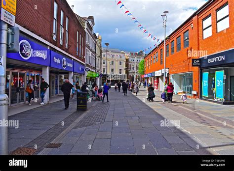 People Walking Along Caroline Street One Of The Main Shopping Streets In The Welsh Town Of Bridgend Stock Photo Alamy