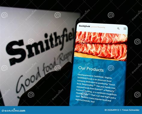 Person Holding Smartphone With Logo Of Us Food Processing Company