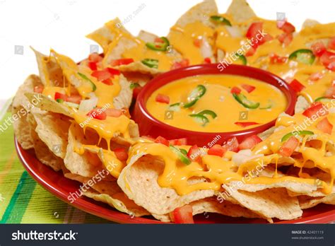 Plate Of Fresh Nachos With A Spicy Jalapeno Cheese Sauce Stock Photo Plate Of Fresh Nachos With A Spicy Jalapeno Cheese Sauce Stock Photo