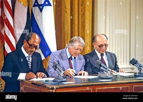 President Anwar Sadat Of Egypt Left United States President Jimmy Carter Center And Prime Minister Menahem Begin Of Israel Right Sign The Camp David Accords At A Ceremony In The East Room