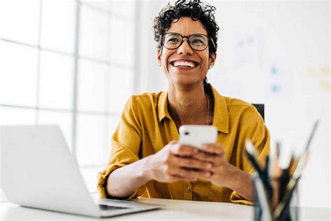 Professional Black Woman Smiling And Using A Mobile Phone Business