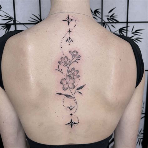 Tattoos Designs Flowers Stars Floral Space Spine Tattoo