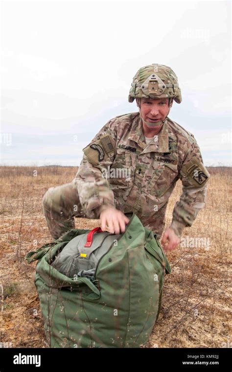 U S Army Maj Gen Paul Lacamera Deputy Commanding General Of The Xviii Airborne Corps Recovers His Parachute During The 20Th Annual Randy Oler Memorial Operation Toy Drop At Fort Bragg North Carolina