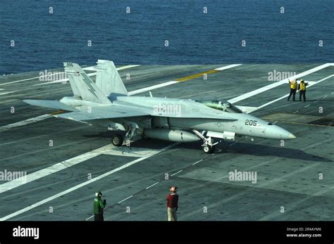 Us Navy An F A 18C Hornet Taxies After Landing Aboard The Flight Deck Us Navy An F A 18C Hornet Taxies After Landing Aboard The Flight Deck