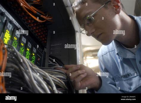 Us Navy Information Systems Technician 1St Class Checks Connections On